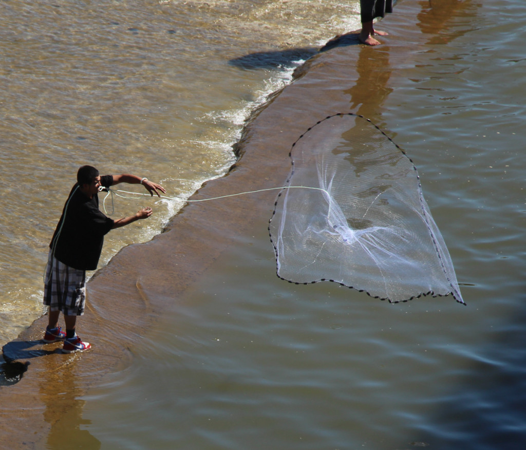 fisherman throwing his net